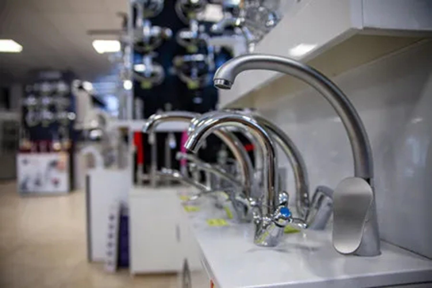 Kitchen water taps on display in a showroom Kitchen water taps on display in a showroom